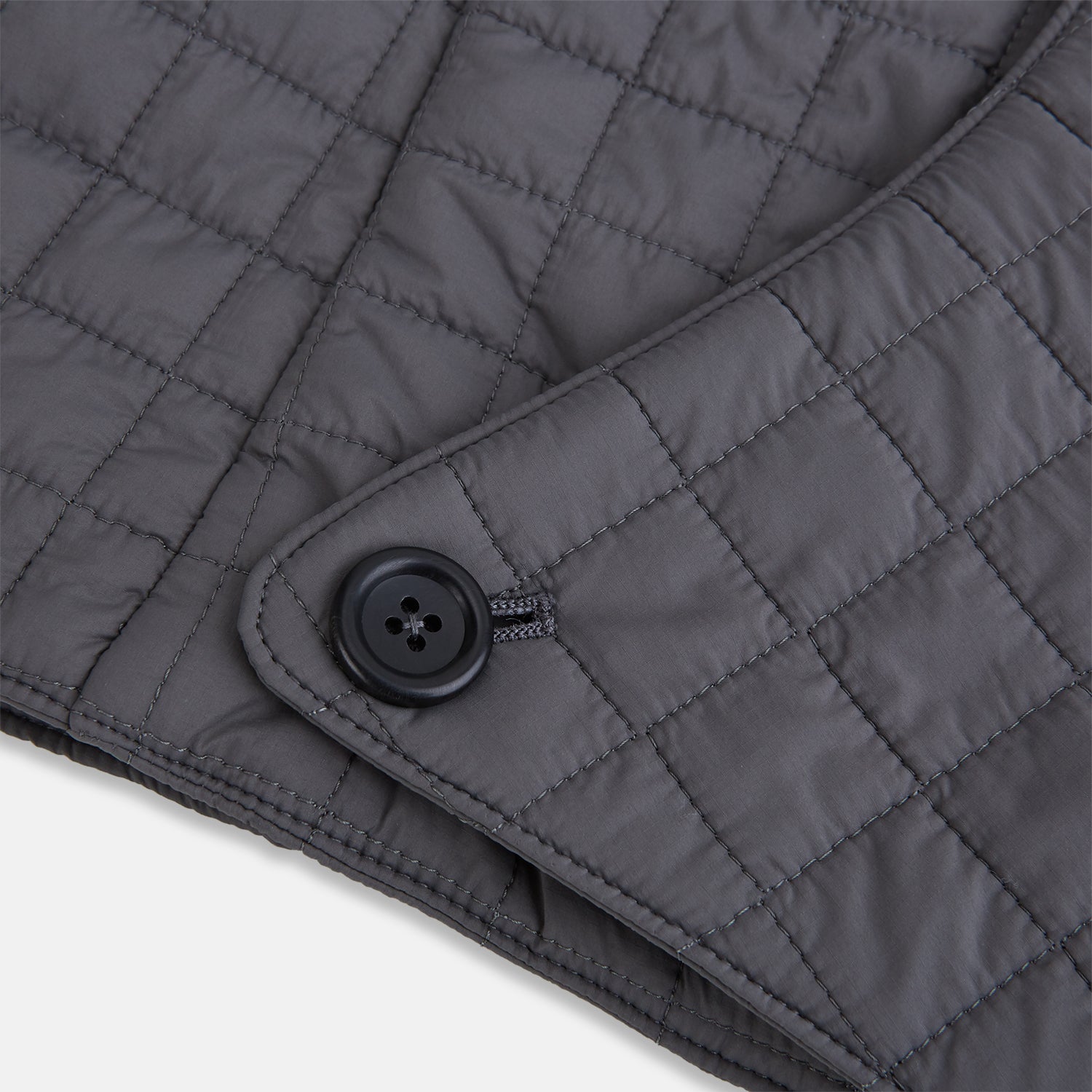 Image 5 of product The Turnbull & Asser Shadow Grey Quilted Hood with Neck Warmer features a button closure, inspired by quilted jacket hoods, and is displayed on a plain white background.