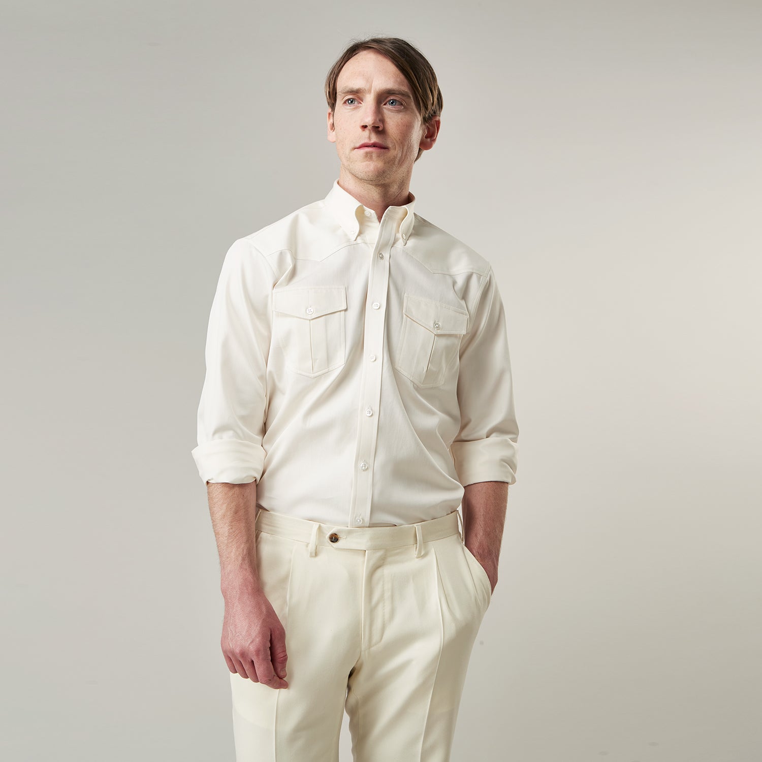 View 4 of product The Cream Cotton Weekend Fit Western Shirt with Dorset Collar by Turnbull & Asser features two chest pockets and is laid flat on a white background—ideal for smart-casual style.