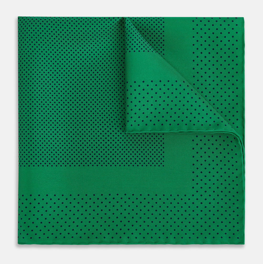 The Turnbull & Asser Green Dot Silk Pocket Square is handmade in England and shown neatly folded, revealing the front and part of the underside against a white background.