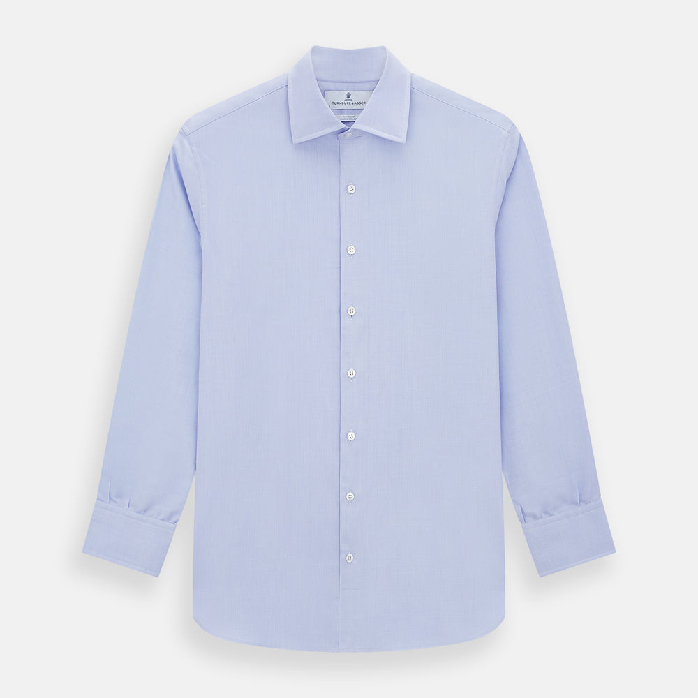 The Turnbull & Asser Blue Herringbone Tailored Fit Shirt with Kent Collar features a formal light blue design, long sleeves, white buttons, and a 3-button cuff. Shown flat on a white background.