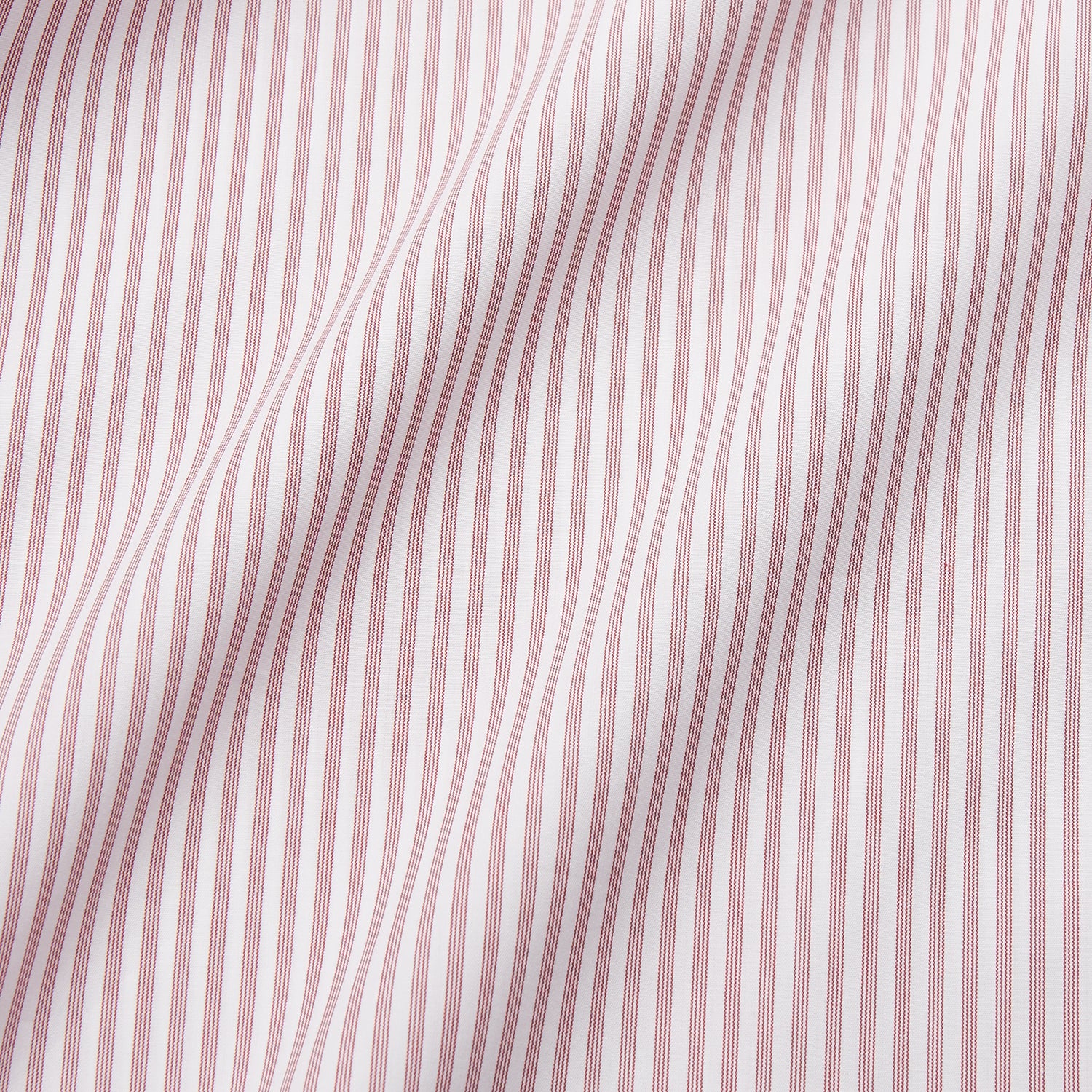 View 5 of product The Turnbull & Asser Burgundy Stripe West Indian Sea Island Cotton Regular Fit Mayfair Shirt features thin vertical red and white stripes, a classic collar, and long sleeves, shown on a plain white background.