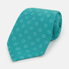 View 1 of product The Turquoise Medallion Silk Tie by Turnbull & Asser is crafted from fine English silk and features a repeating medallion pattern in lighter shades on turquoise.