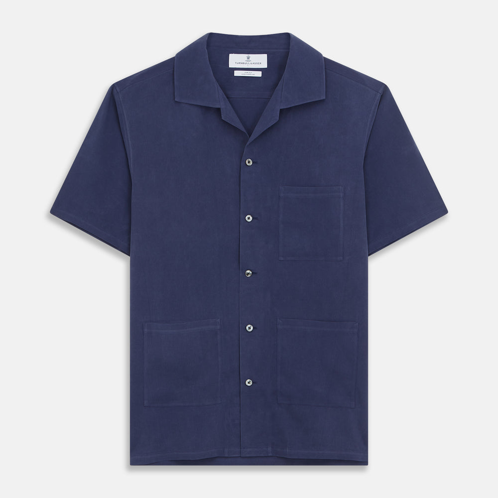 The Navy Silk Holiday Fit Phillips Shirt by Turnbull & Asser features short sleeves, a revere collar, and three front patch pockets, shown laid flat on a white background.