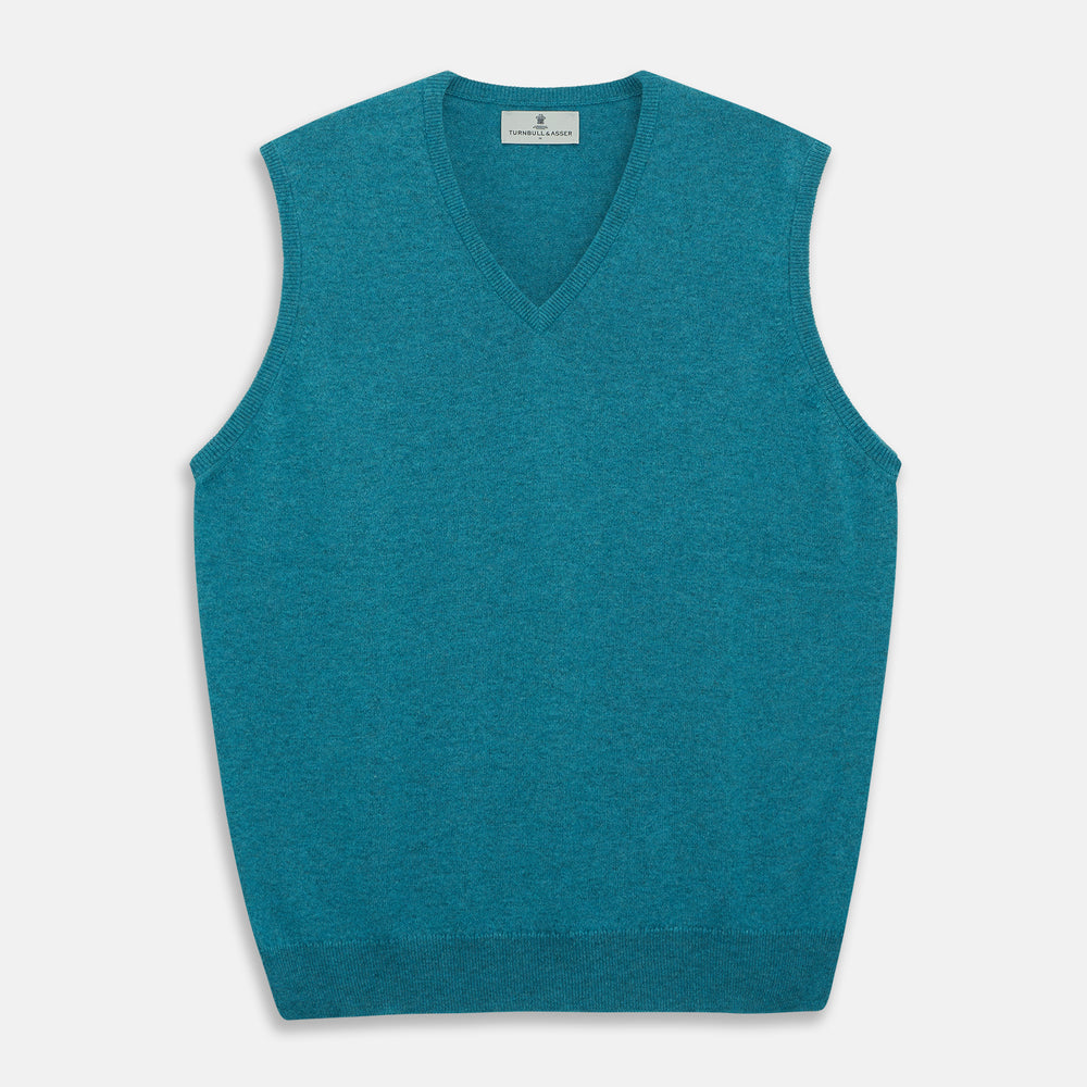 The Teal Ifor Slipover by Turnbull & Asser is a sleeveless, V-neck knit made in Scotland from lightweight cashmere, shown in teal blue against a white background.