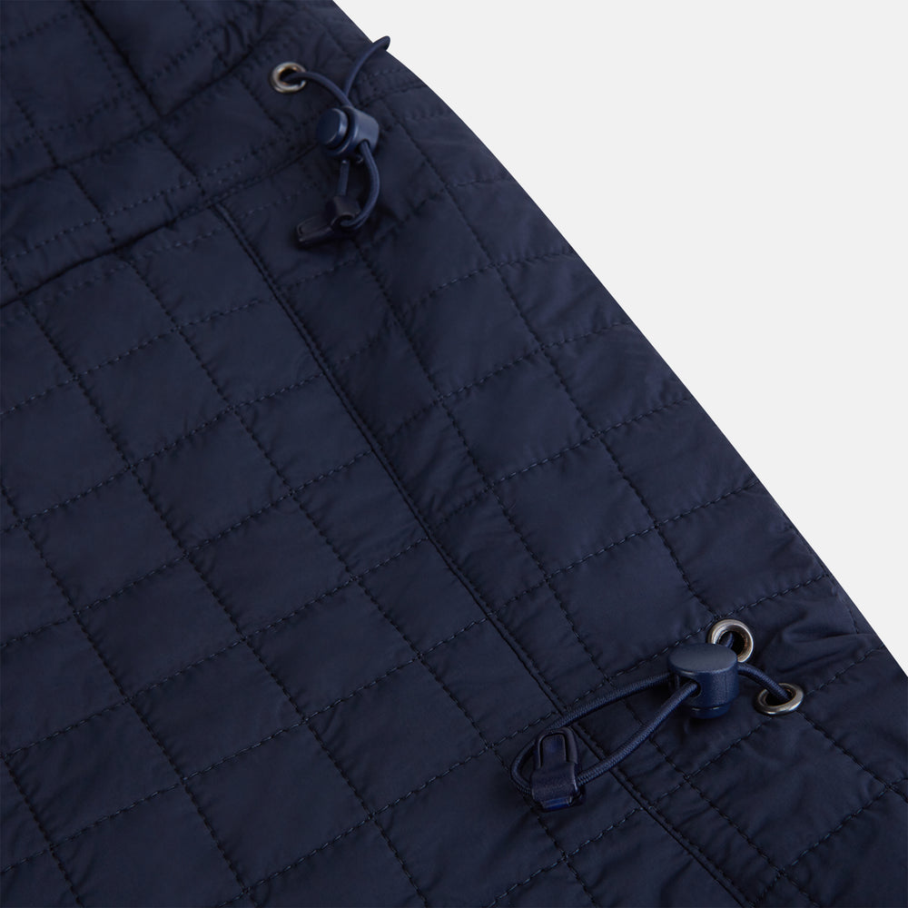 The Turnbull & Asser Navy Quilted Hood with Neck Warmer features diamond pattern stitching, a structured hood, overlapping collar, and button closure, shown on a plain white background.