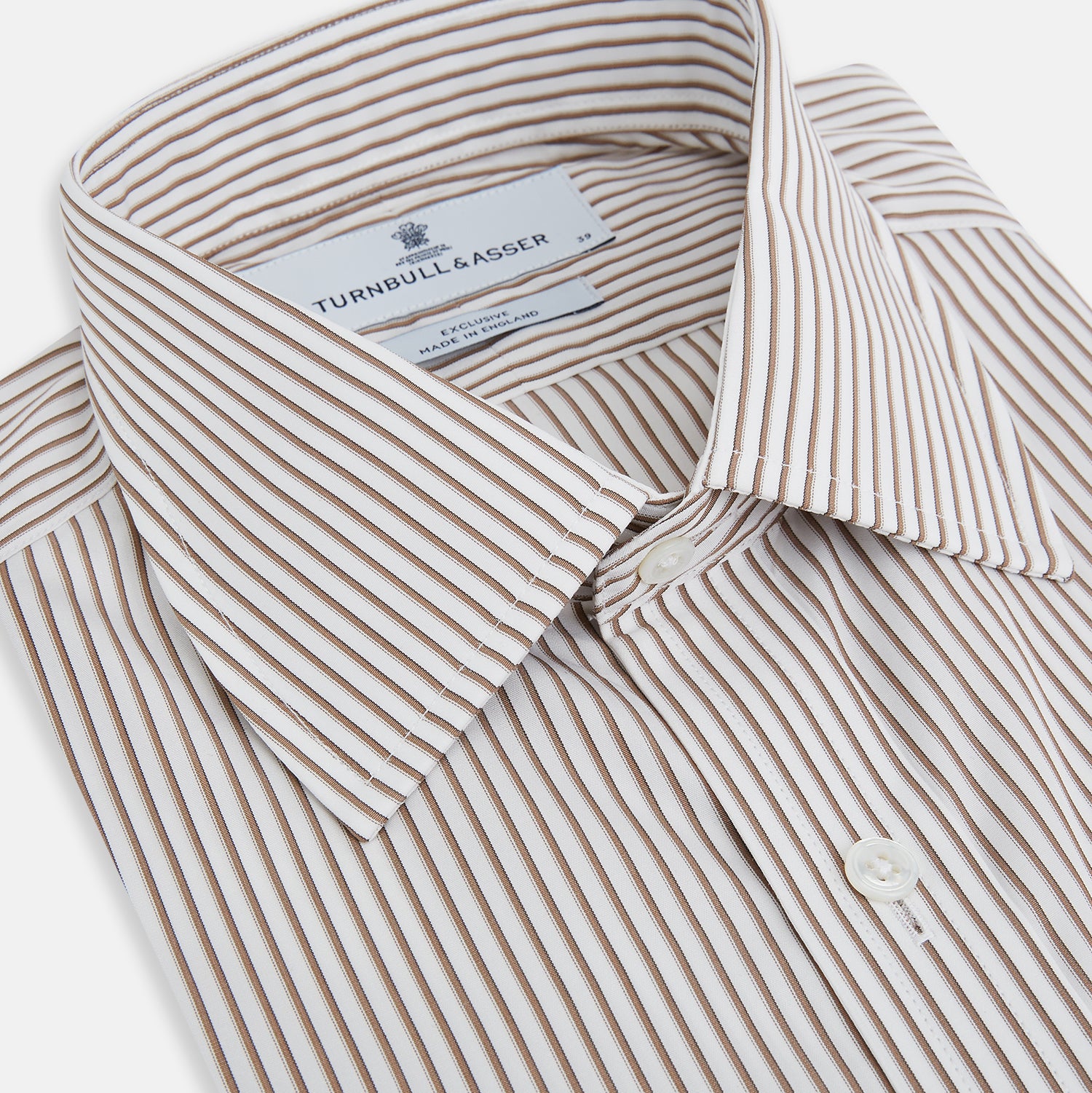 View 2 of product The Coffee Shadow Stripe Mayfair Shirt by Turnbull & Asser is a long-sleeve, button-down style with a T&A collar and fine beige and white stripes, crafted from premium Italian cotton and shown on a white background.