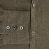 View 4 of product The Olive Linen Windsor Shirt by Turnbull & Asser features long sleeves, a classic Windsor collar, buttoned cuffs, and a straight hem—expertly crafted in Britain and shown against a white background.