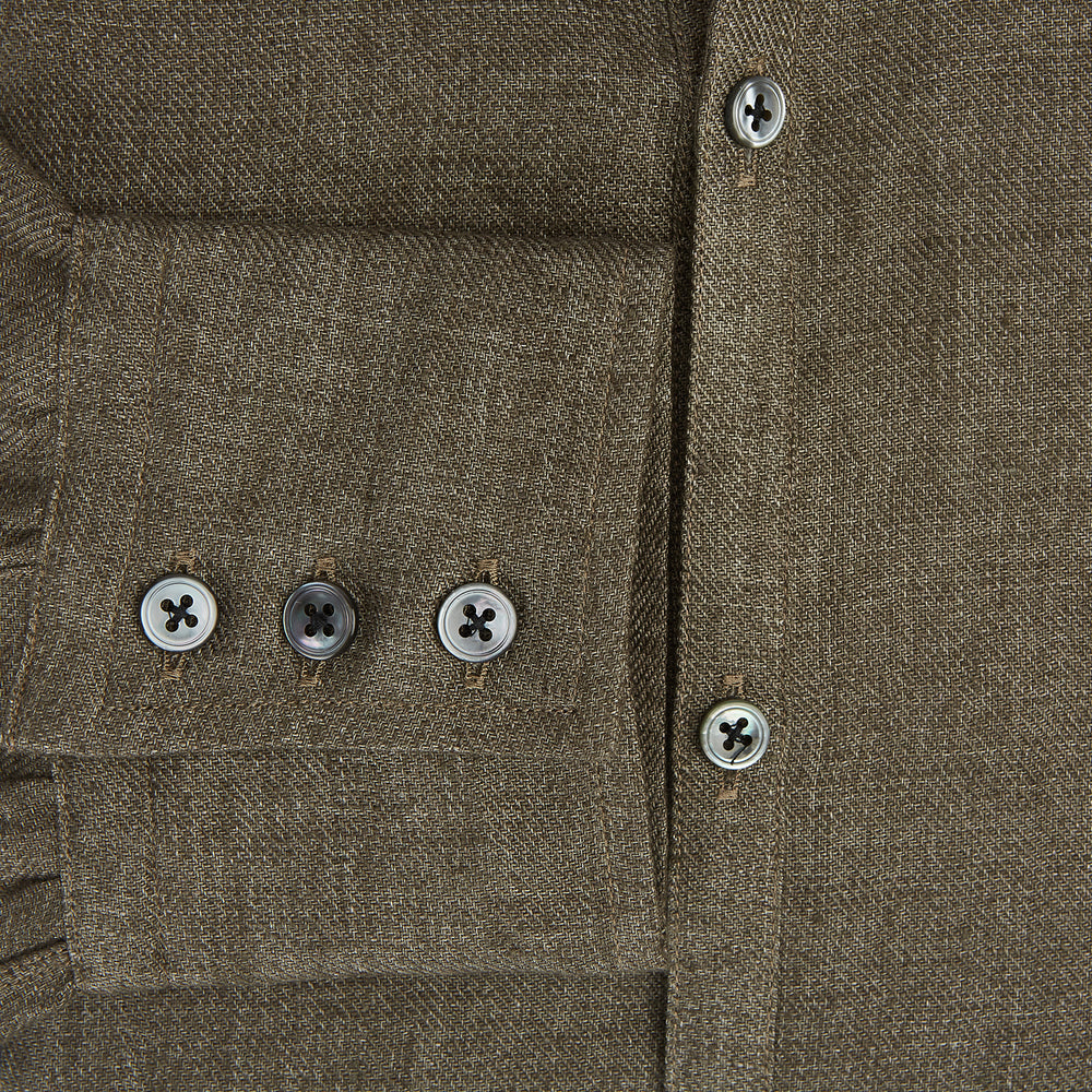 The Olive Linen Windsor Shirt by Turnbull & Asser features long sleeves, a classic Windsor collar, buttoned cuffs, and a straight hem—expertly crafted in Britain and shown against a white background.