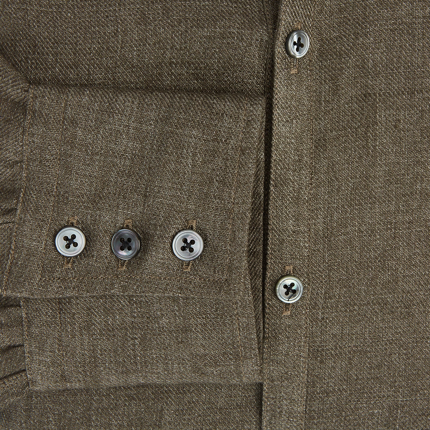View 4 of product The Olive Linen Windsor Shirt by Turnbull & Asser features long sleeves, a classic Windsor collar, buttoned cuffs, and a straight hem—expertly crafted in Britain and shown against a white background.