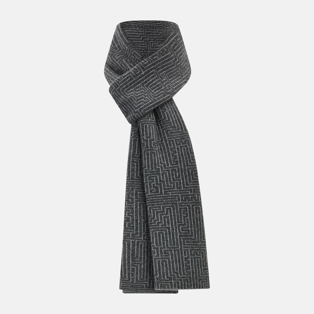 The Turnbull & Asser Grey Fretwork Cashmere Knitted Scarf showcases a geometric maze-like pattern in gray, elegantly looped with draped ends—an essential accessory set against a plain white background.