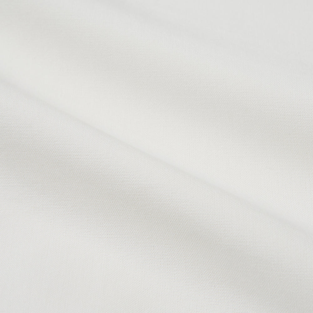 The Turnbull & Asser Cream Silk Tailored Fit Shirt is a long-sleeve button-up with a pointed collar and buttoned cuffs, displayed laid flat against a plain white background.