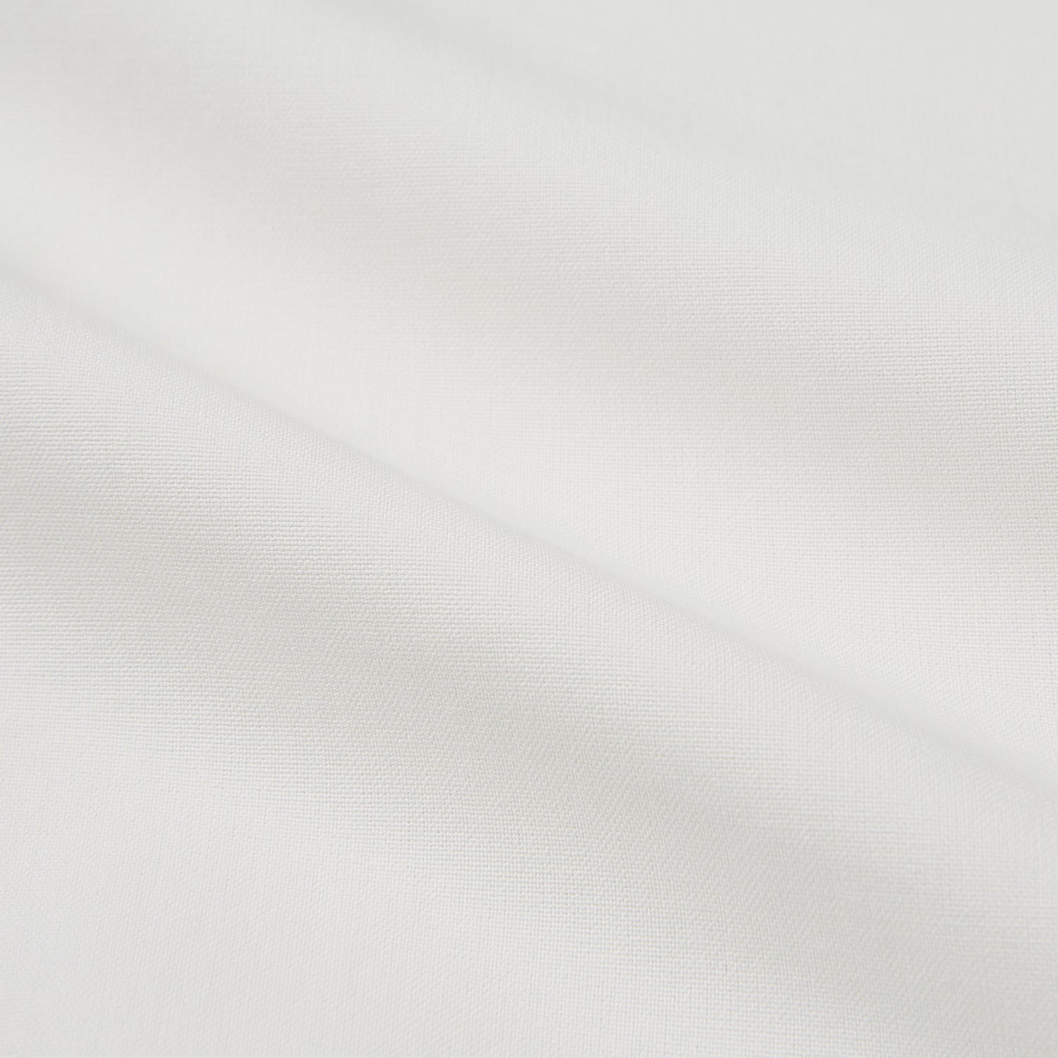 View 5 of product The Turnbull & Asser Cream Silk Tailored Fit Shirt is a long-sleeve button-up with a pointed collar and buttoned cuffs, displayed laid flat against a plain white background.