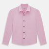 View 1 of product The Pink Hyde Overshirt by Turnbull & Asser is a long-sleeved, light pink sanforised cotton shirt with a left chest pocket and dark buttons—an elegant, laid-back alternative to a blazer.