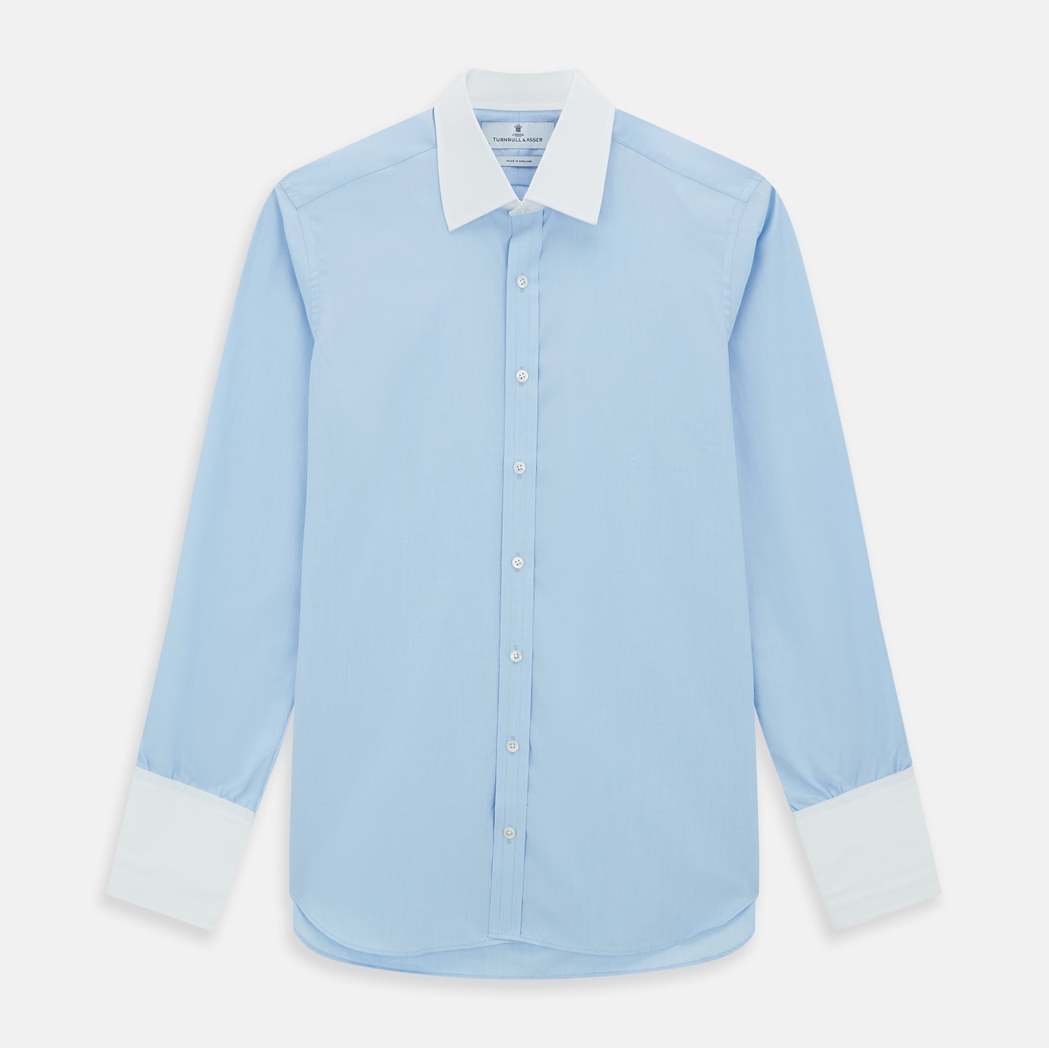 View 1 of product The Turnbull & Asser Light Blue End-on-End Shirt features a crisp white T&A contrast collar and double cuffs, shown flat on a white background.