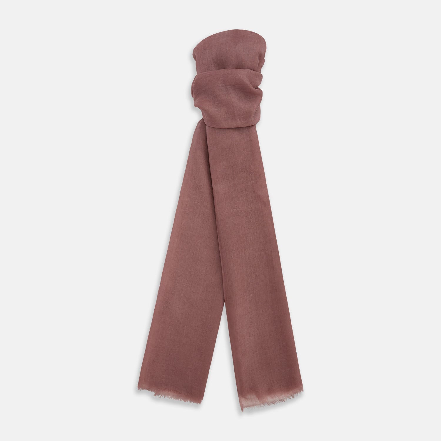 View 1 of product The Turnbull & Asser Pink Cashmere Scarf is a soft, lightweight luxury accessory with frayed edges, beautifully folded and displayed on a white background.