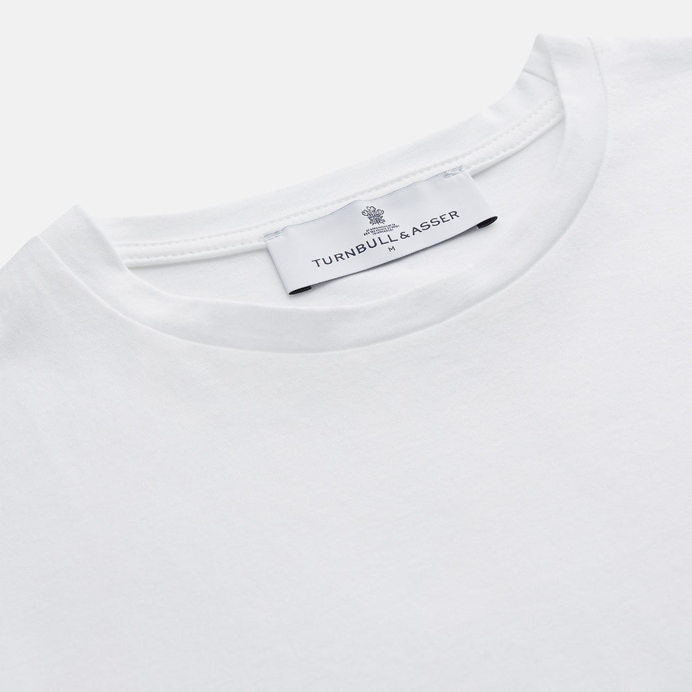 The White Davey Cotton T-Shirt by Turnbull & Asser is a plain white, fine-gauge jersey crew neck with short sleeves and a small neck tag, made in the UK and shown on a white background with no logos or designs.