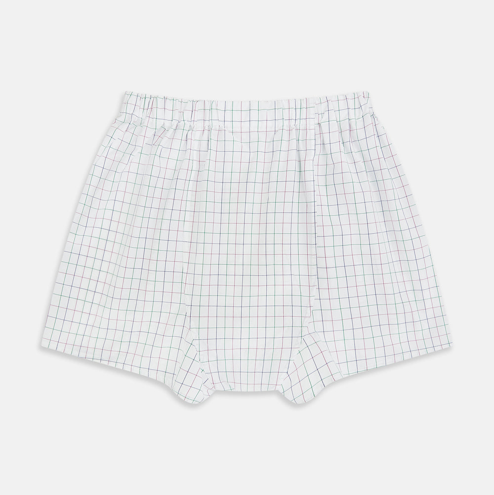 Turnbull & Asser Pink Grid Check Godfrey Boxer Shorts, crafted from Italian cotton with an elastic waistband, feature a pink grid pattern. The luxury boxer shorts are displayed flat against a plain white background.