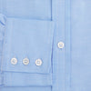 View 4 of product The Blue Herringbone Mayfair Shirt by Turnbull & Asser features light blue and white stripes, long sleeves, a classic collar, white buttons, and buttoned cuffs. Shown on a plain white background, it's perfect for formal occasions.