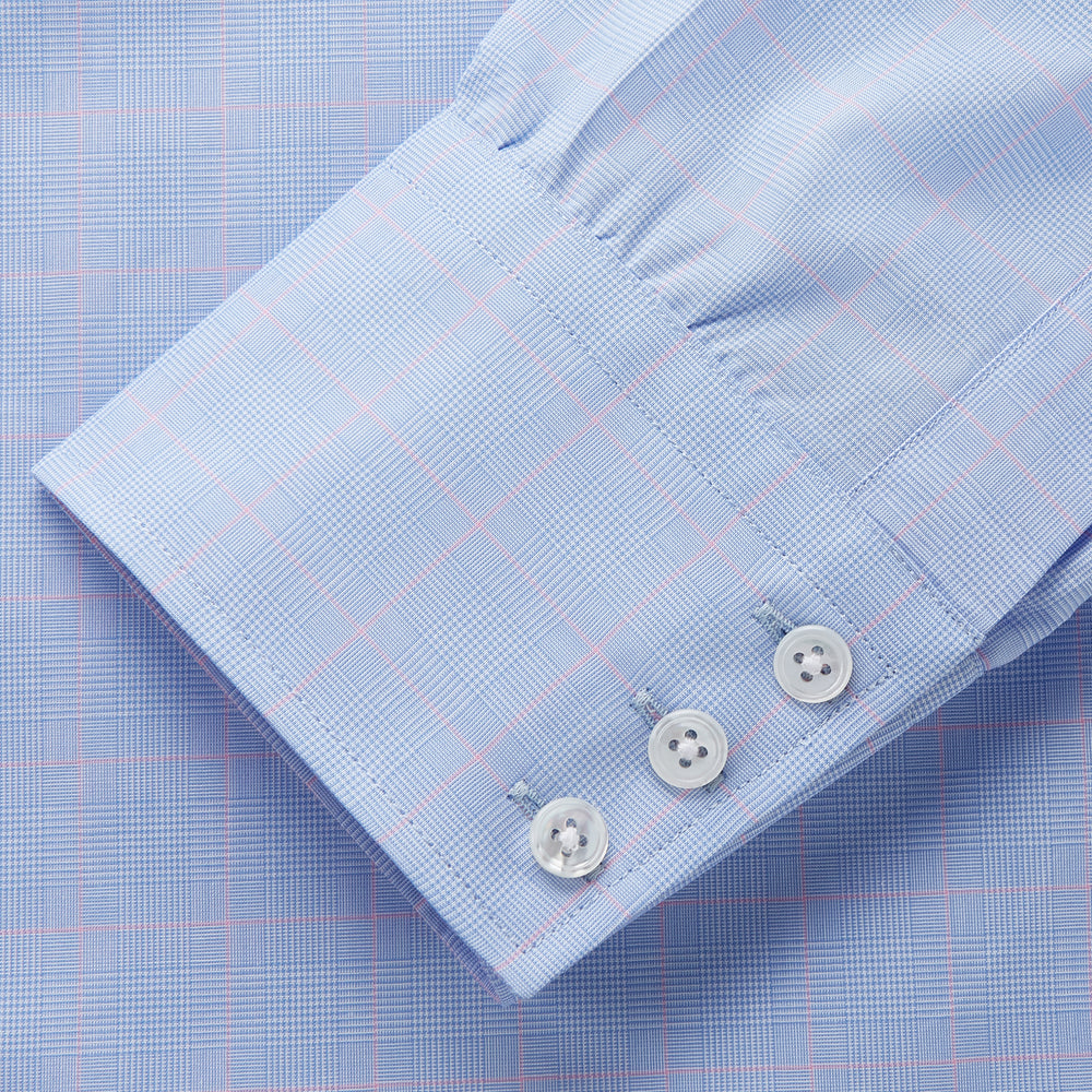 A Turnbull & Asser Blue and Pink Prince of Wales Check Mayfair Shirt with long sleeves, classic collar, buttoned front and cuffs, is neatly laid flat on a white background.