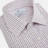 View 2 of product The Turnbull & Asser Red and Blue Multi Check Mayfair Shirt is a long-sleeve button-down made from Italian cotton with a white base and a light red and blue check pattern, shown laid flat on a white background.