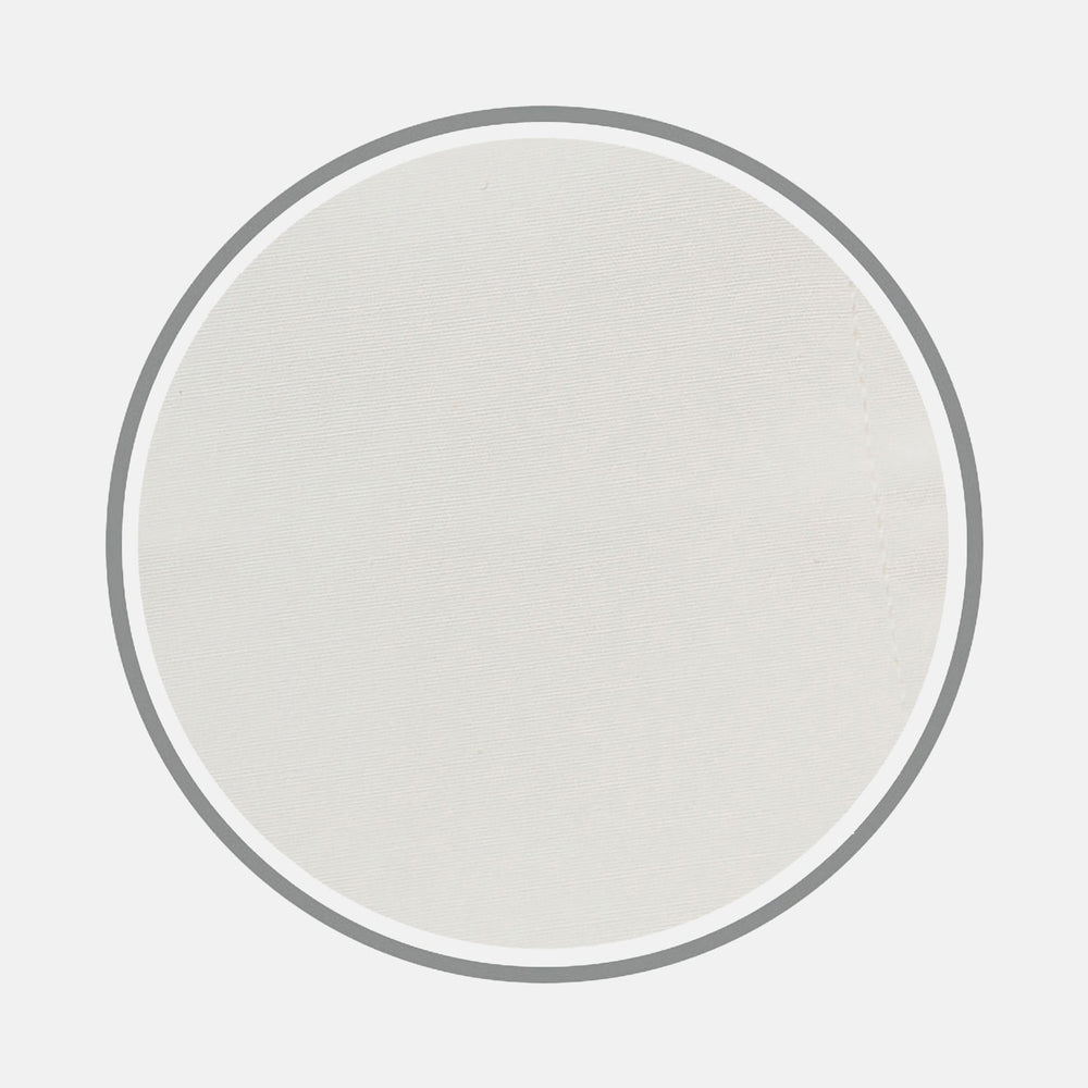 A close-up of Turnbull & Asser's Cream Cotton Fabric, framed by a circular gray border. The smooth cotton shows a subtle seam on the right, highlighting the product's fine texture and quality.