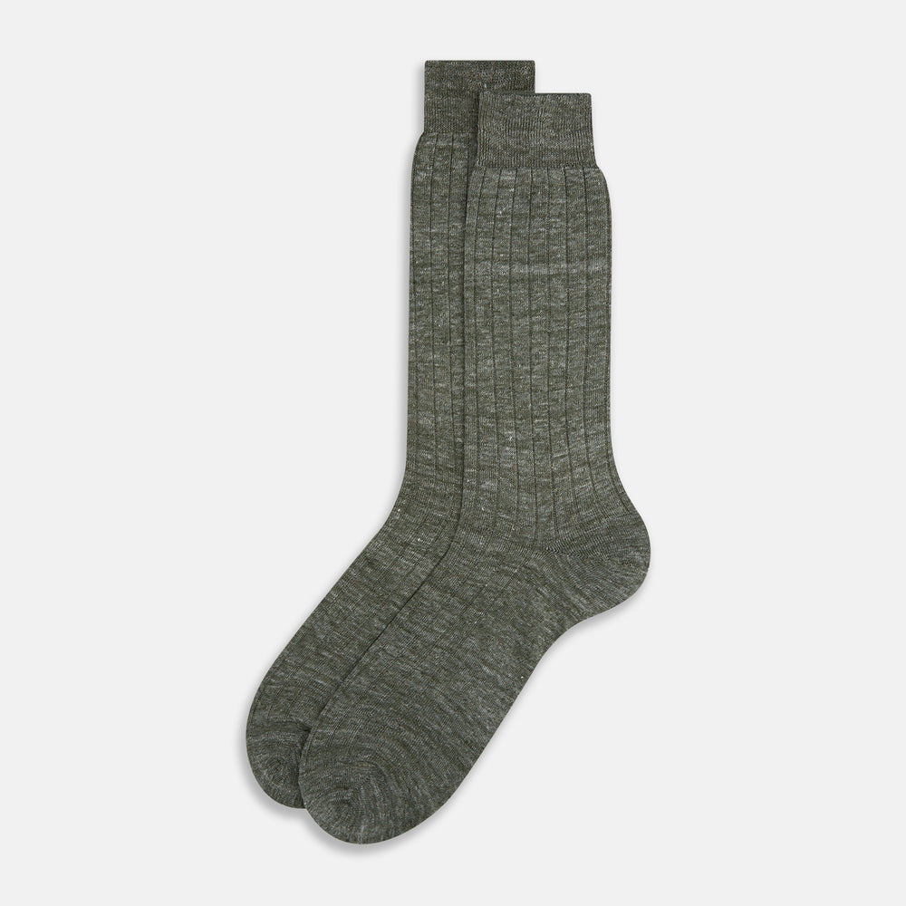The Forest Green Linen Mid-Length Sock by Turnbull & Asser features a ribbed texture and is shown upright on a plain white background. Made from breathable linen, it offers comfort and style for everyday wear.