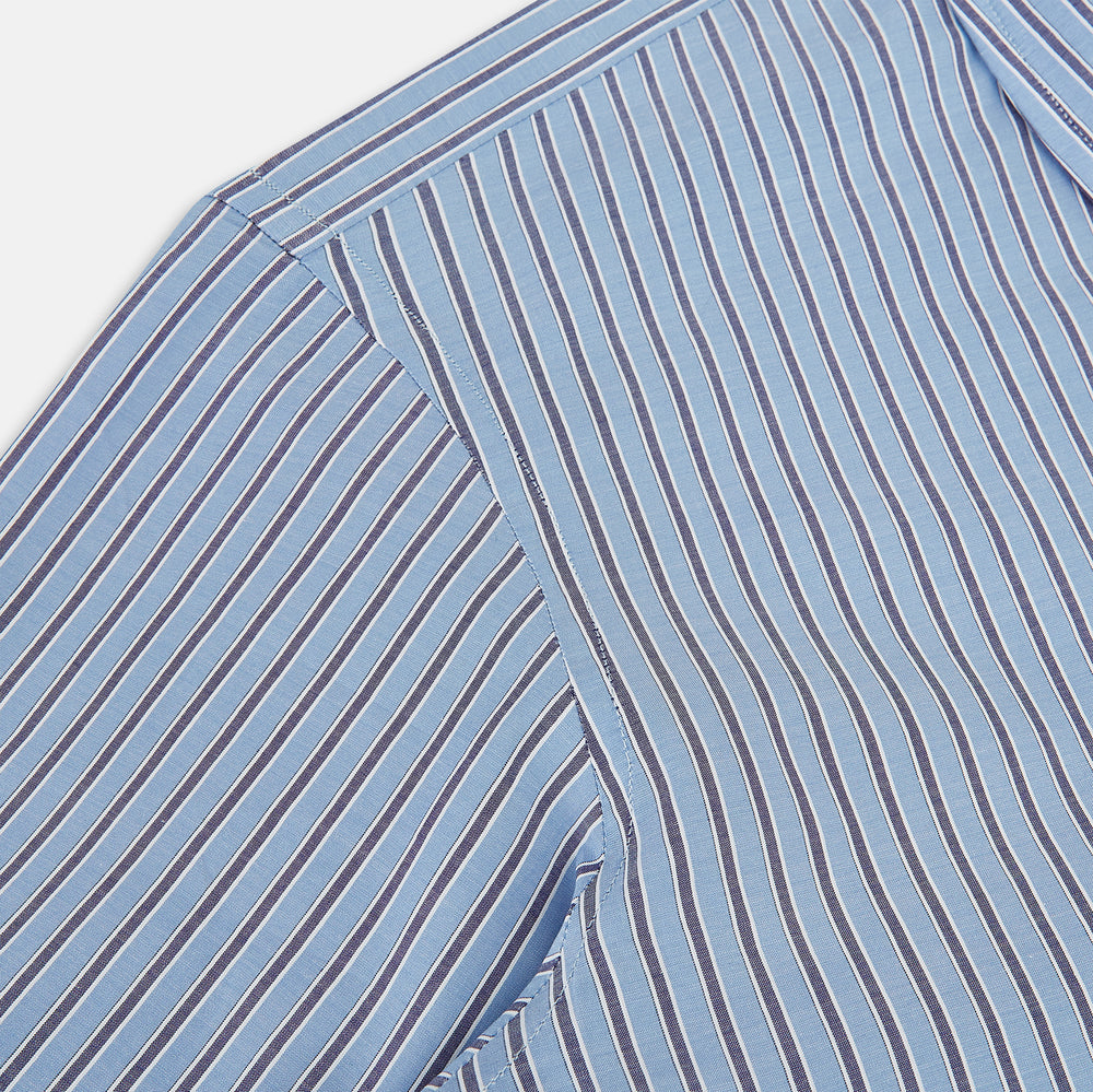 The Steel Blue Ticking Stripe Westminster Shirt by Turnbull & Asser features a classic fit, Turnbull collar, vertical stripes, white buttons, and buttoned cuffs—showcasing refined British craftsmanship.