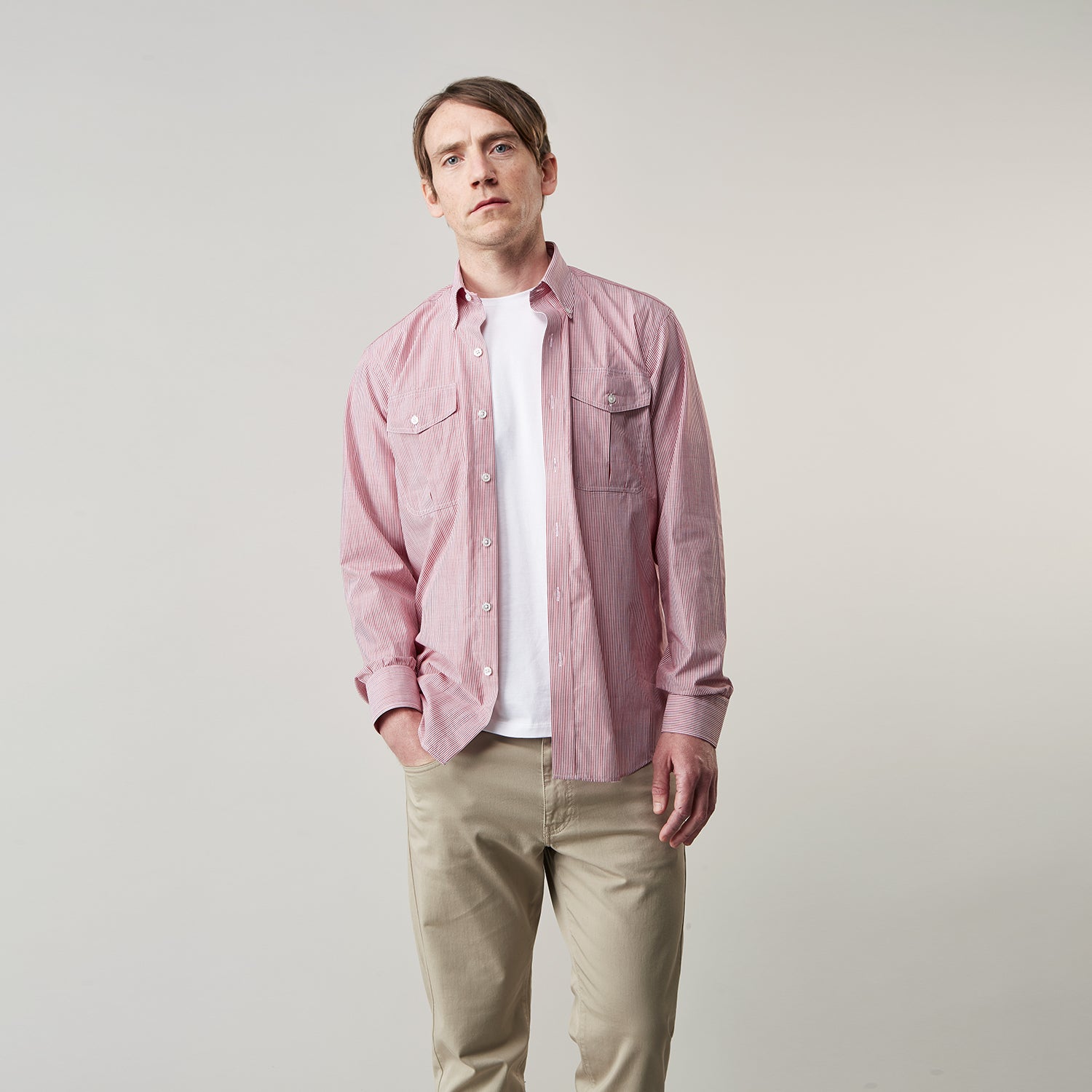 View 2 of product The Turnbull & Asser Dark Red Chambray Stripe Weekend Fit Shirt with a Dorset collar features striped cotton, two chest pockets with button flaps, and white front and cuff buttons—perfect for a relaxed yet stylish weekend look.