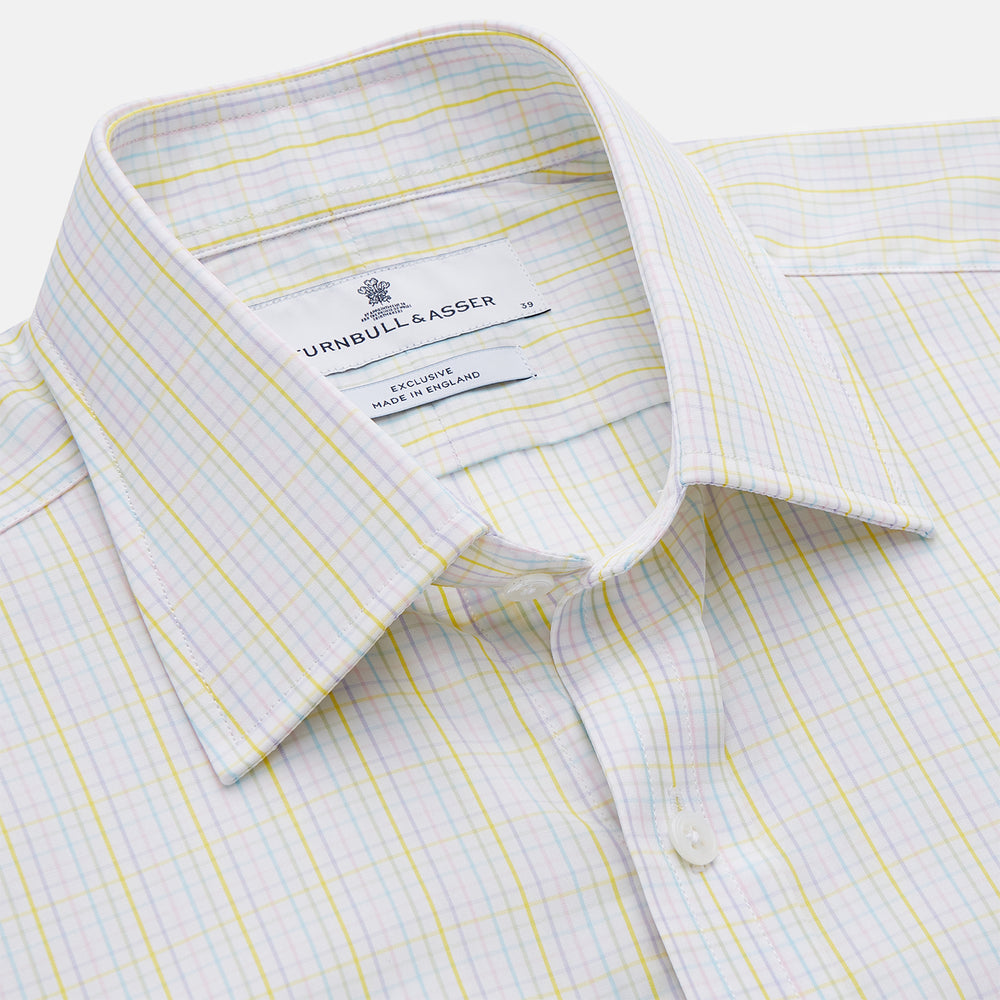 The Turnbull & Asser Yellow Multi Check Cotton Regular Fit Mayfair Shirt features a long-sleeved, button-up design with yellow and blue plaid, pointed collar, and buttoned cuffs, laid flat on a white background.