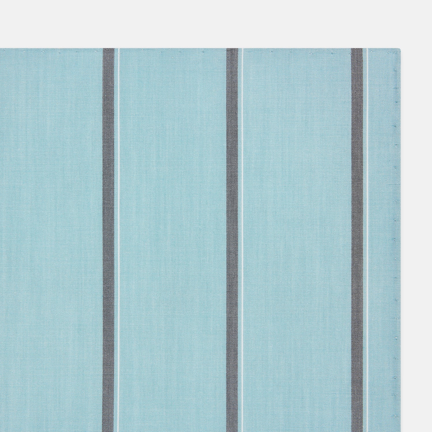View 2 of product The Turnbull & Asser Light Sage Track Stripe Hand-Rolled Handkerchief features vertical thin white and thicker dark gray stripes, neatly folded with a simple modern design, made in England.