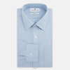 View 4 of product The Turnbull & Asser Pale Blue Cotton Cashmere Derby Collar Richmond Shirt features a soft cotton-cashmere blend, derby collar, white buttons, left chest pocket, and buttoned cuffs, shown laid flat on a white background.