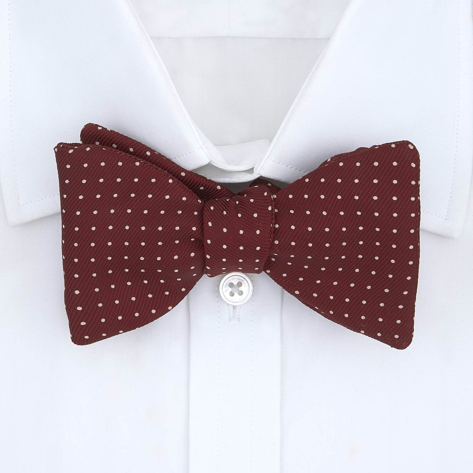 View 2 of product The Turnbull & Asser Burgundy and White Small Spot Printed Silk Bow Tie is shown on a plain white background.