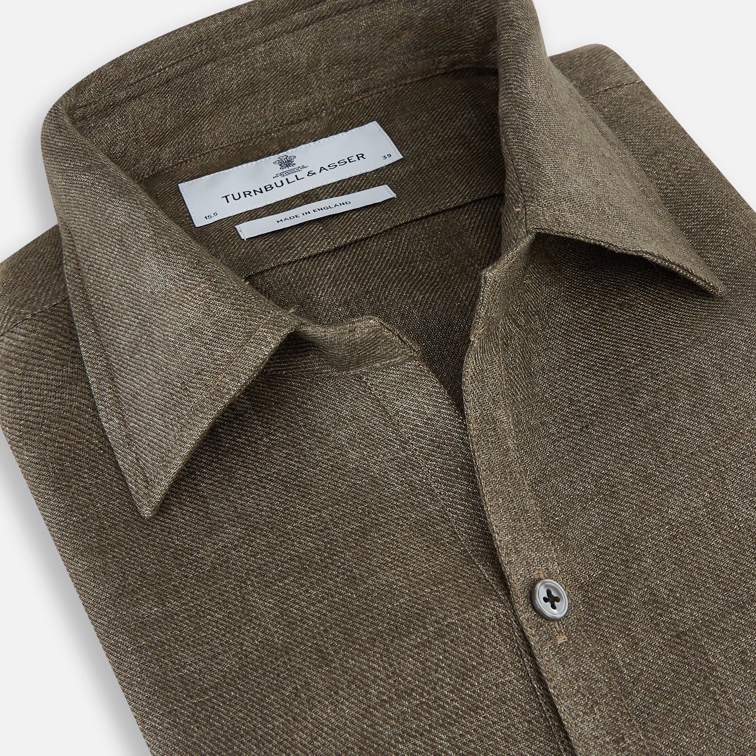 View 2 of product The Olive Linen Windsor Shirt by Turnbull & Asser features long sleeves, a classic Windsor collar, buttoned cuffs, and a straight hem—expertly crafted in Britain and shown against a white background.