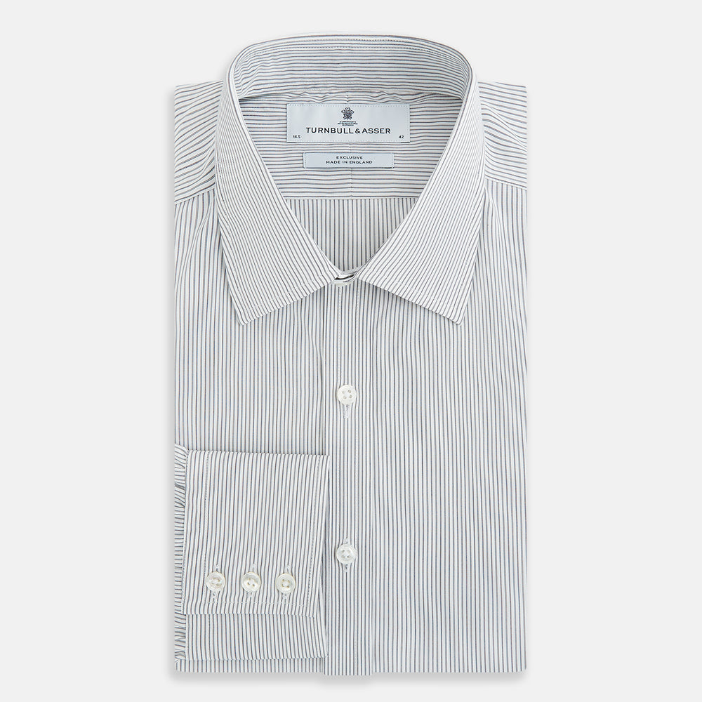 A long-sleeved Midnight Blue Fine Track Stripe Mayfair Shirt by Turnbull & Asser, featuring a T&A collar and white buttons, is laid neatly flat on a white background.