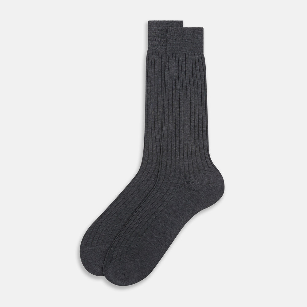 The Turnbull & Asser Steel Melange Mid-Length Sock, in dark gray ribbed mercerised Egyptian cotton, is shown upright on a white background to highlight its elegant shape and texture.