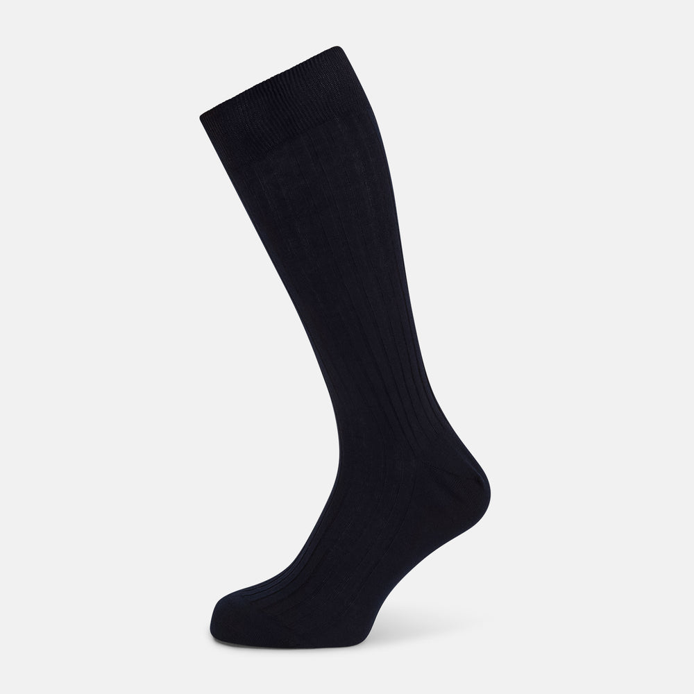 A single navy mid-length sock by Turnbull & Asser, crafted from organic cotton with a ribbed texture, stands upright on a white background.