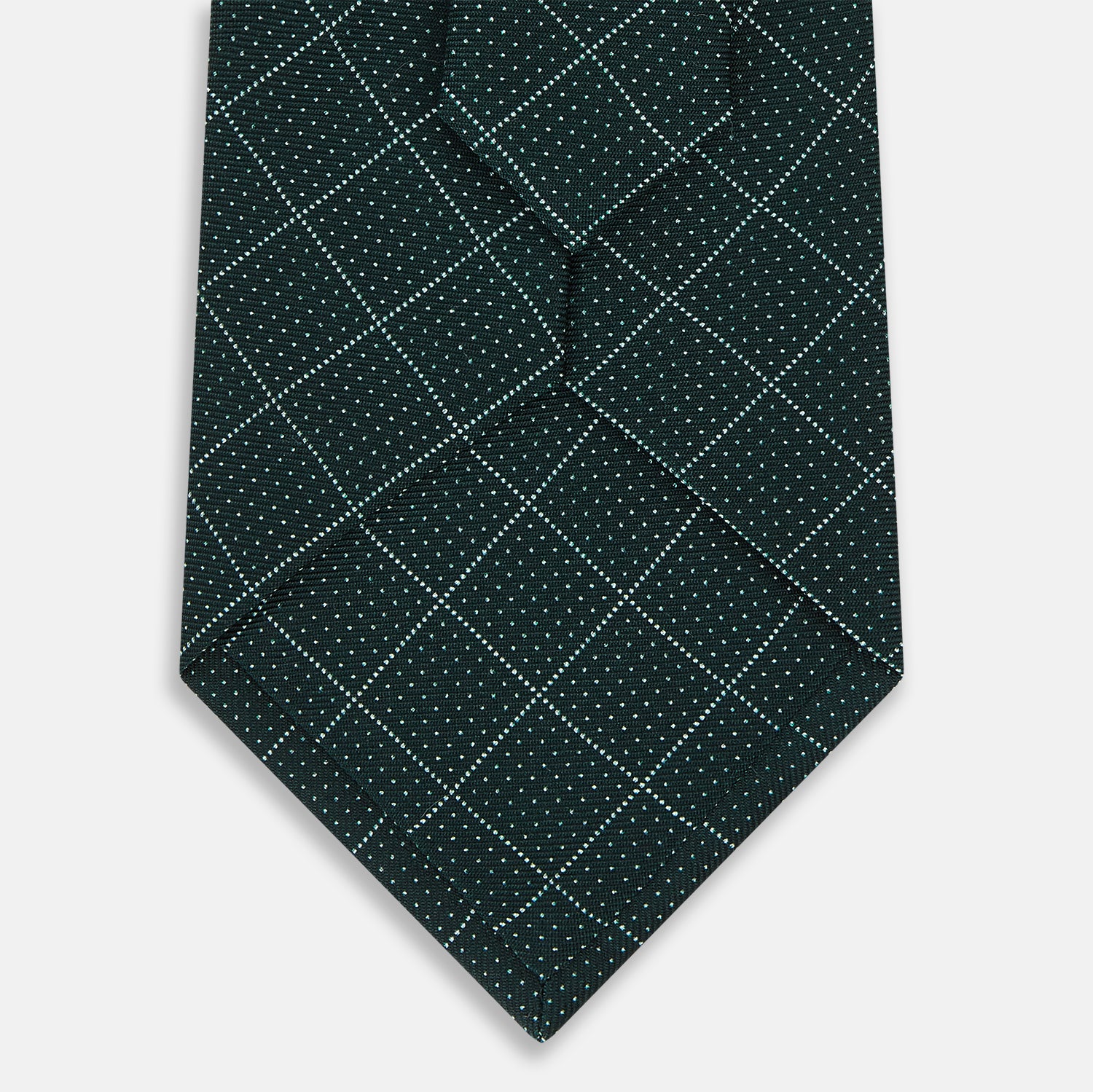 View 3 of product The Turnbull & Asser Light Petrol Dotted Check Pattern Printed Silk Tie is neatly rolled and displayed on a plain white background.