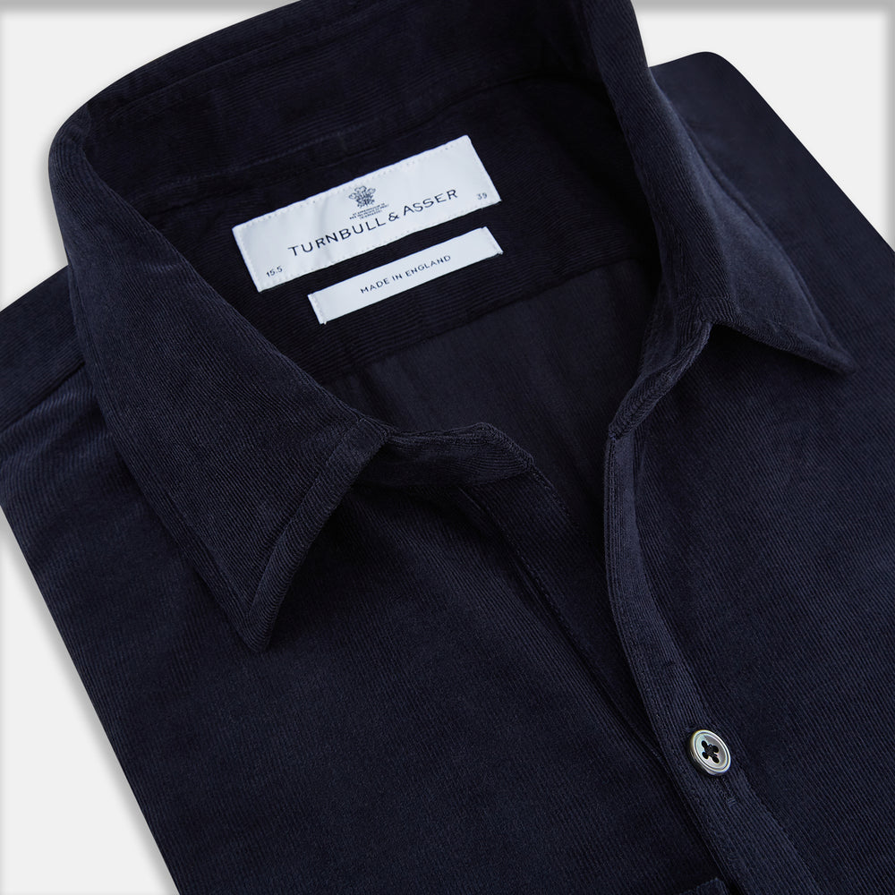 A navy corduroy Windsor shirt by Turnbull & Asser, featuring British craftsmanship and a classic collar, displayed on a plain white background.