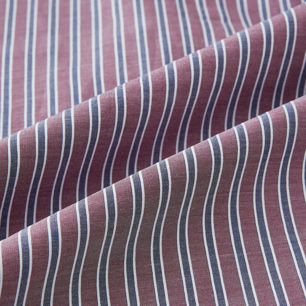 The Turnbull & Asser Wine Ticking Stripe Westminster Shirt features red, blue, and white vertical pinstripes on white and is shown laid flat on a white surface.
