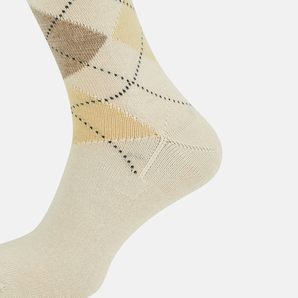 A single Turnbull & Asser White Wool Check Mid-Length Sock, featuring a subtle check pattern in tan, cream, and light brown shades, is displayed on a plain white background.