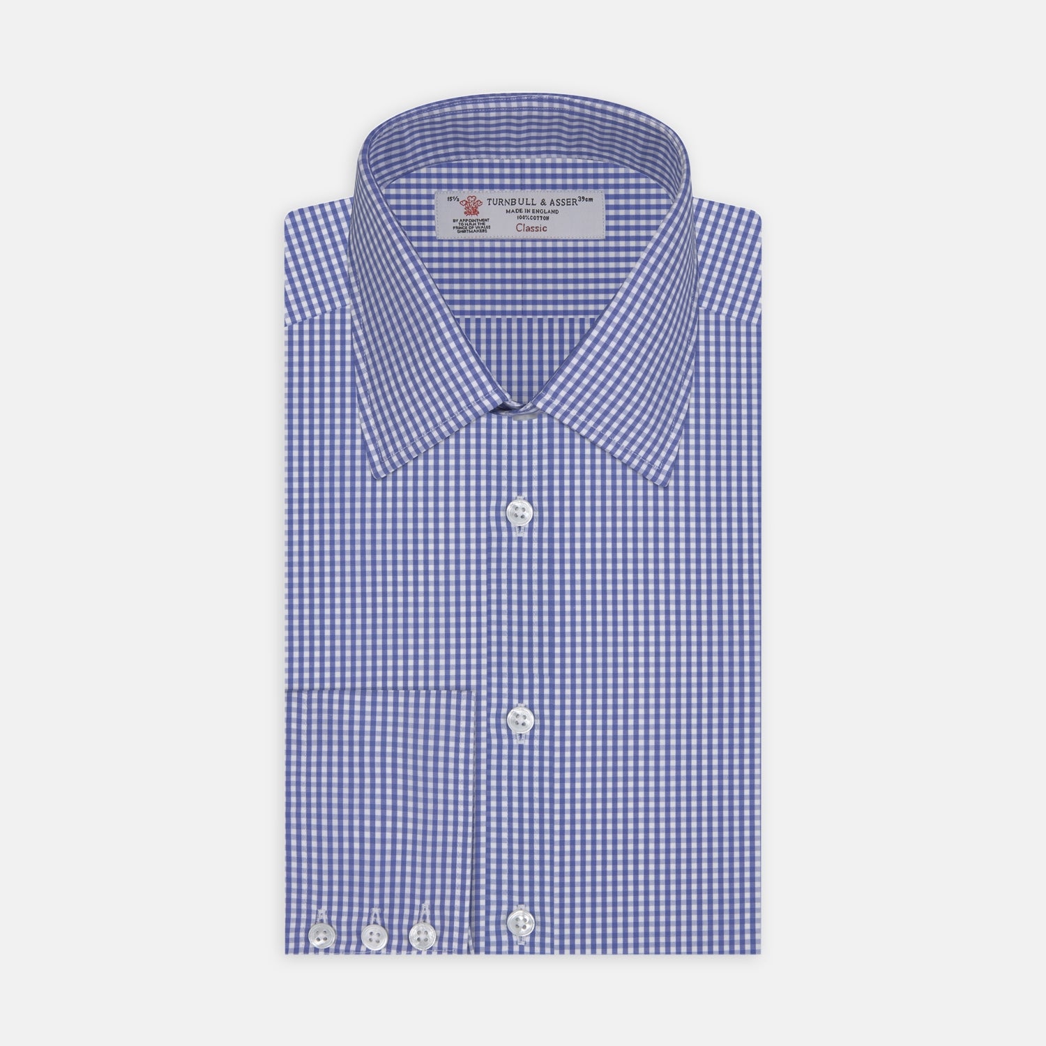 View 1 of product The Turnbull & Asser Mid-Blue Gingham Check Shirt features a T&A collar and 3-button cuffs, crafted from soft cotton and displayed against a plain white background.