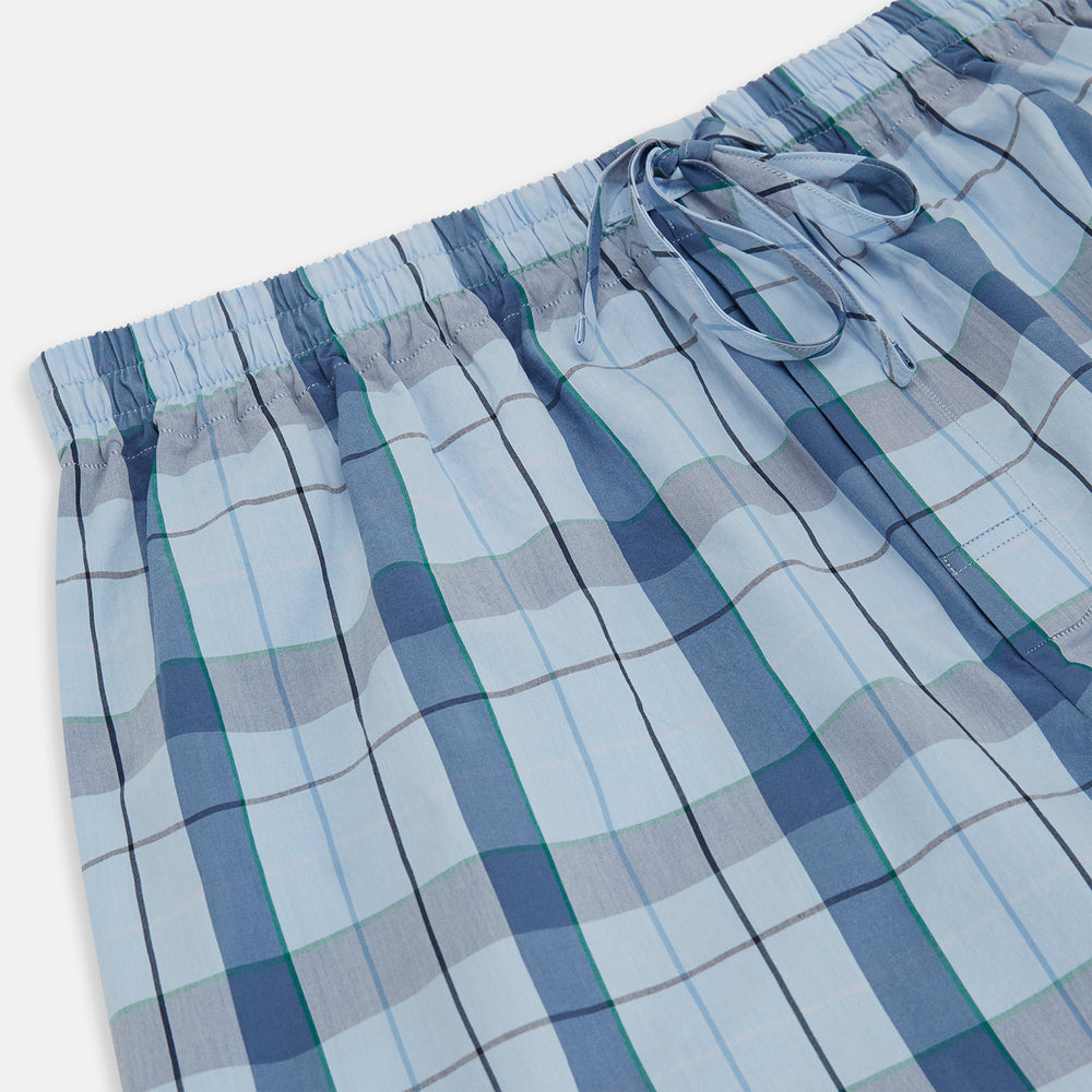 Turnbull & Asser Blue Multi Check Pyjama Trousers, featuring intersecting blue and white lines and a drawstring waistband, laid flat on a white background. Perfect to pair with your favorite cotton T-shirt for cozy comfort.
