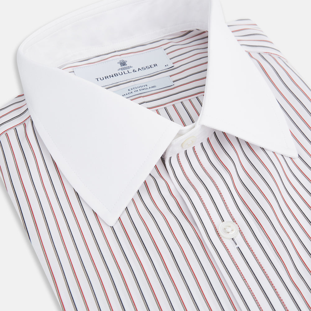 The Red Double Stripe Shirt with contrast T&A collar and cuffs by Turnbull & Asser features classic thin vertical red stripes and solid white collar and cuffs, laid flat on a white background for a timeless look.