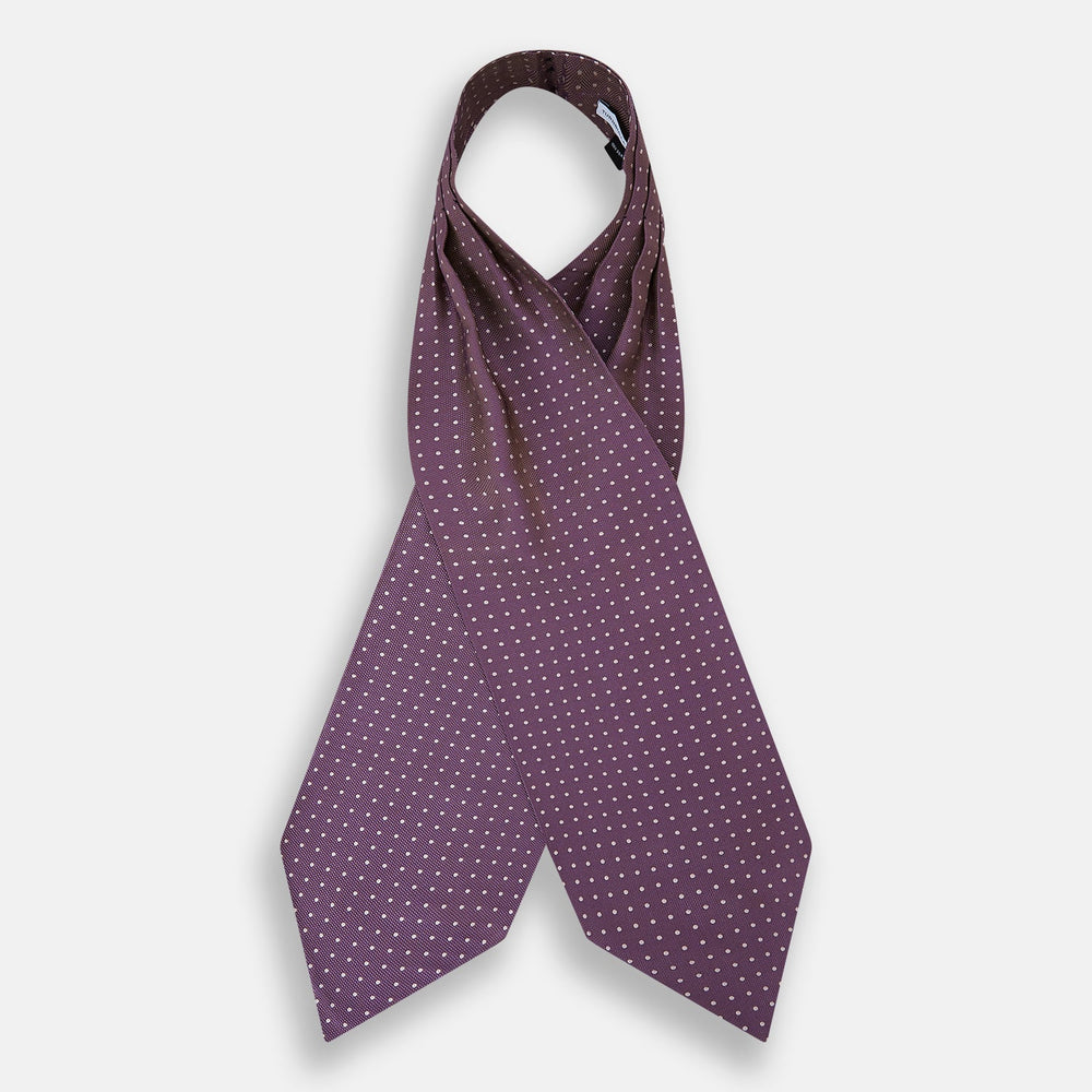 The Lilac and Violet Micro Dot Silk Cravat by Turnbull & Asser features small white polka dots on elegant silk, expertly crafted for a refined look, and is shown against a white background.