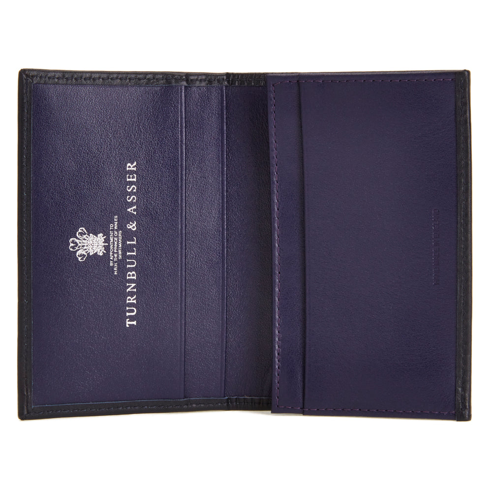 The Deep Blue Foldable Card Case by Turnbull & Asser stands upright and partially open, displaying its rich blue interior against a plain white background.