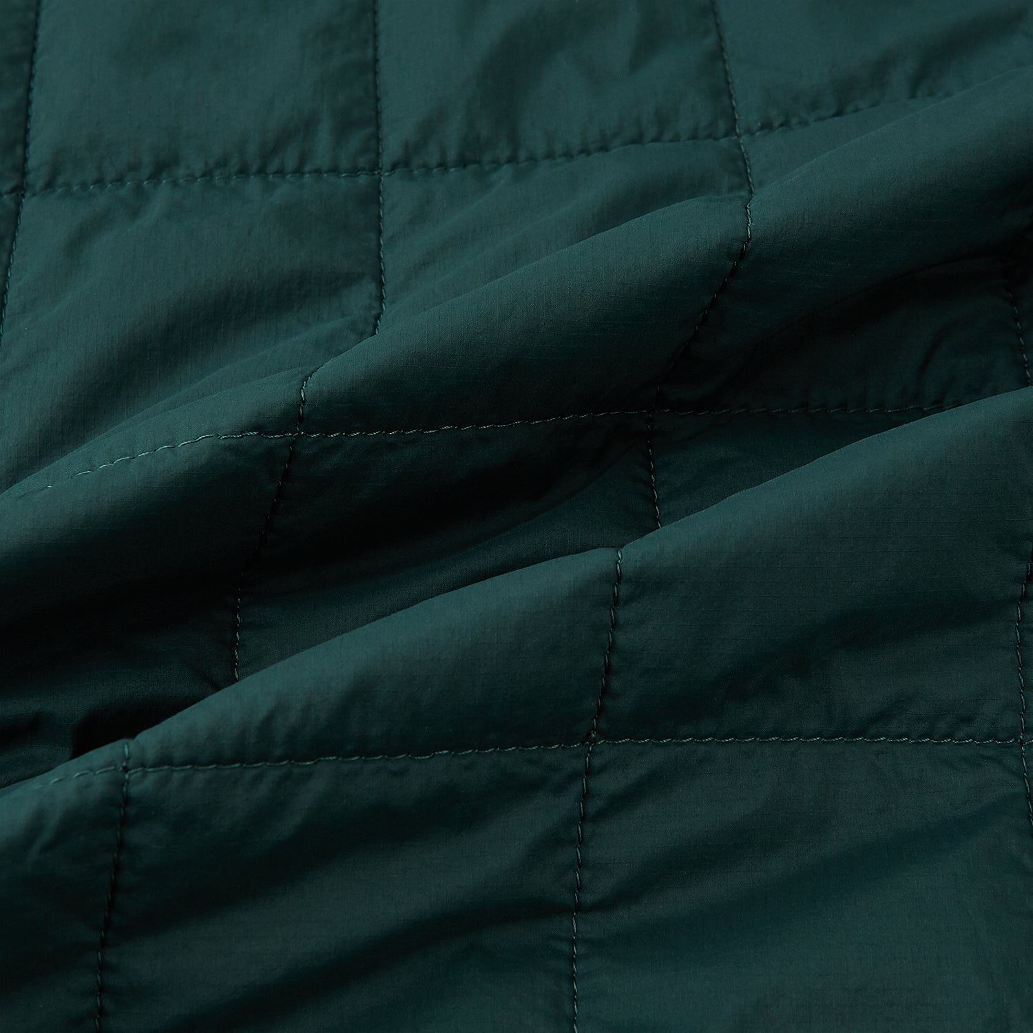 View 4 of product Turnbull & Asser Forest Green Quilted Gilet features a front zipper, two zippered side pockets, and a small chest pocket. Shown against a white background, it's a stylish lightweight layer for any season.