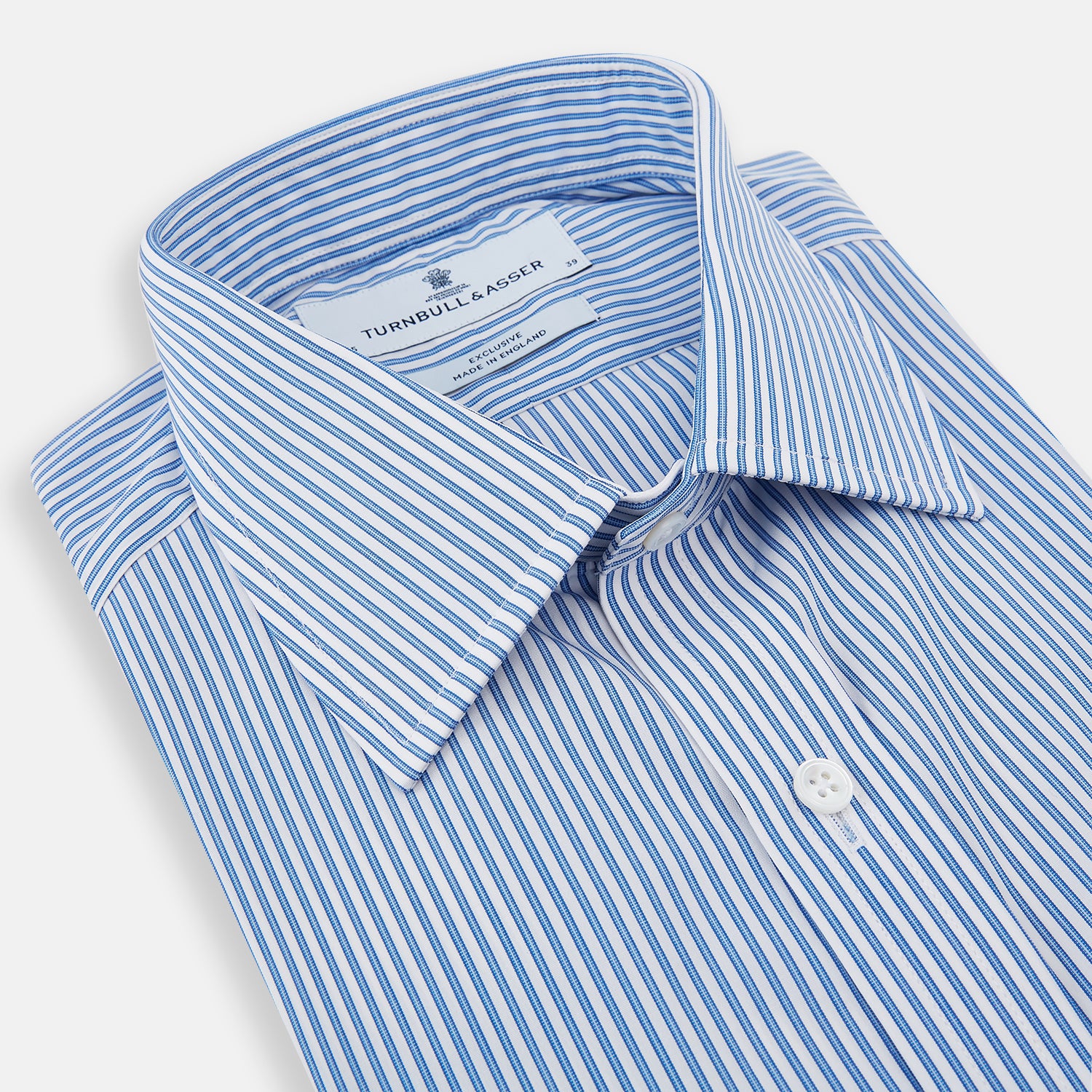 View 2 of product The Sky Blue Halo Stripe Mayfair Shirt by Turnbull & Asser, a long-sleeved button-up with thin blue and white vertical stripes, classic collar and cuffs, is shown laid flat on a white background.