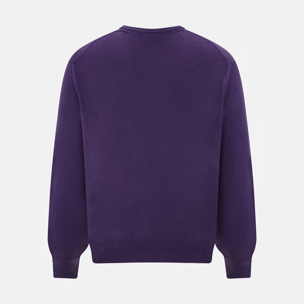 The Turnbull & Asser Purple Cashmere V-neck Jumper features long sleeves with ribbed cuffs and hem—a classic knitwear piece for effortless layering, shown against a white background.