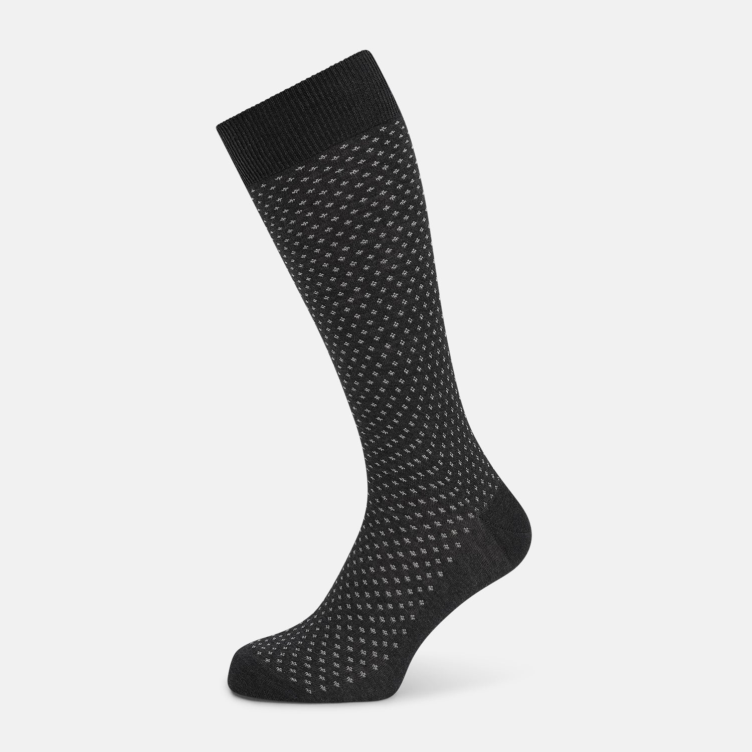 View 1 of product Turnbull & Asser Grey Motif Mid-Length Sock, crafted from Egyptian cotton, features a fine white geometric dot pattern on grey with a solid black cuff, heel, and toe for classic style. Displayed on a white background.