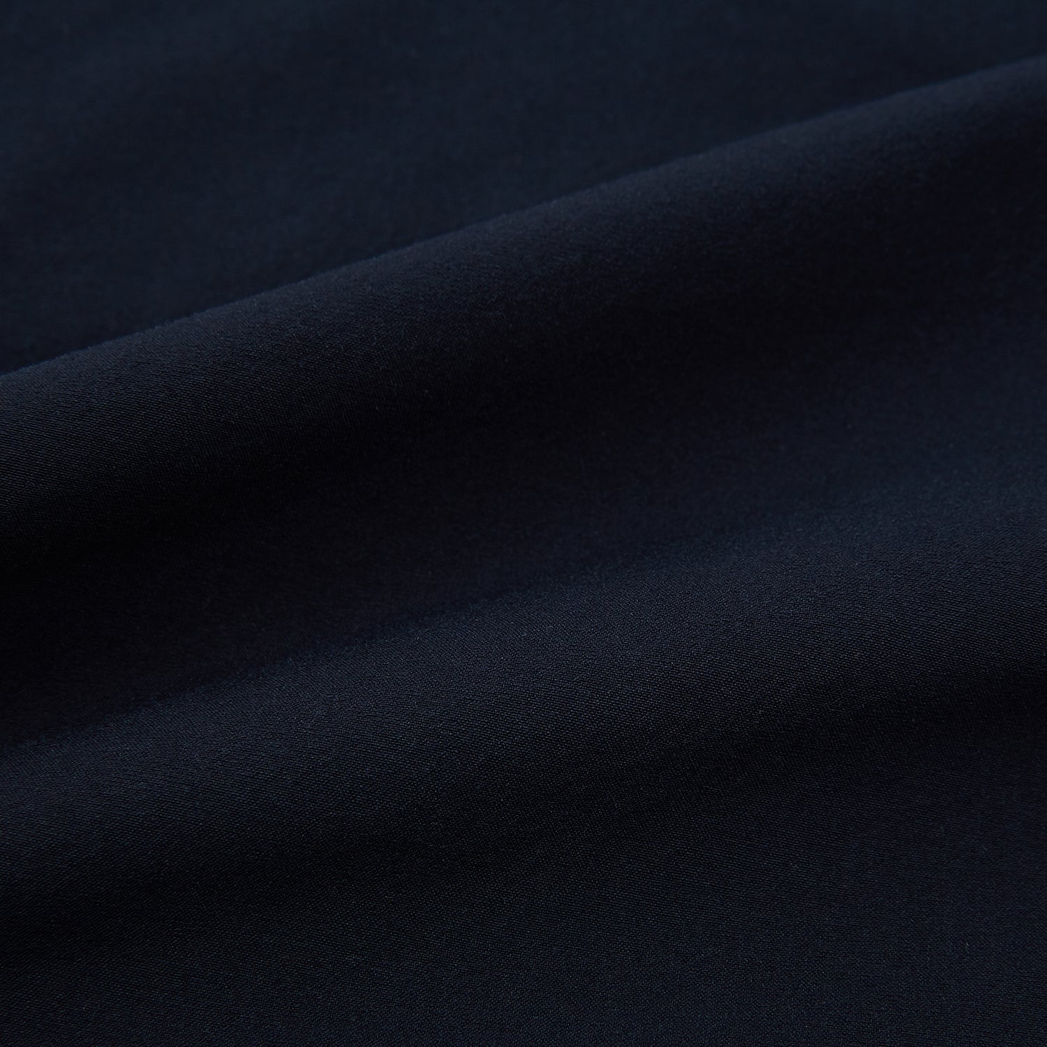 View 15 of product Turnbull & Asser’s Midnight Blue Winston Trousers, in high-twist cotton with belt loops and a button closure, are shown flat against a plain white background.